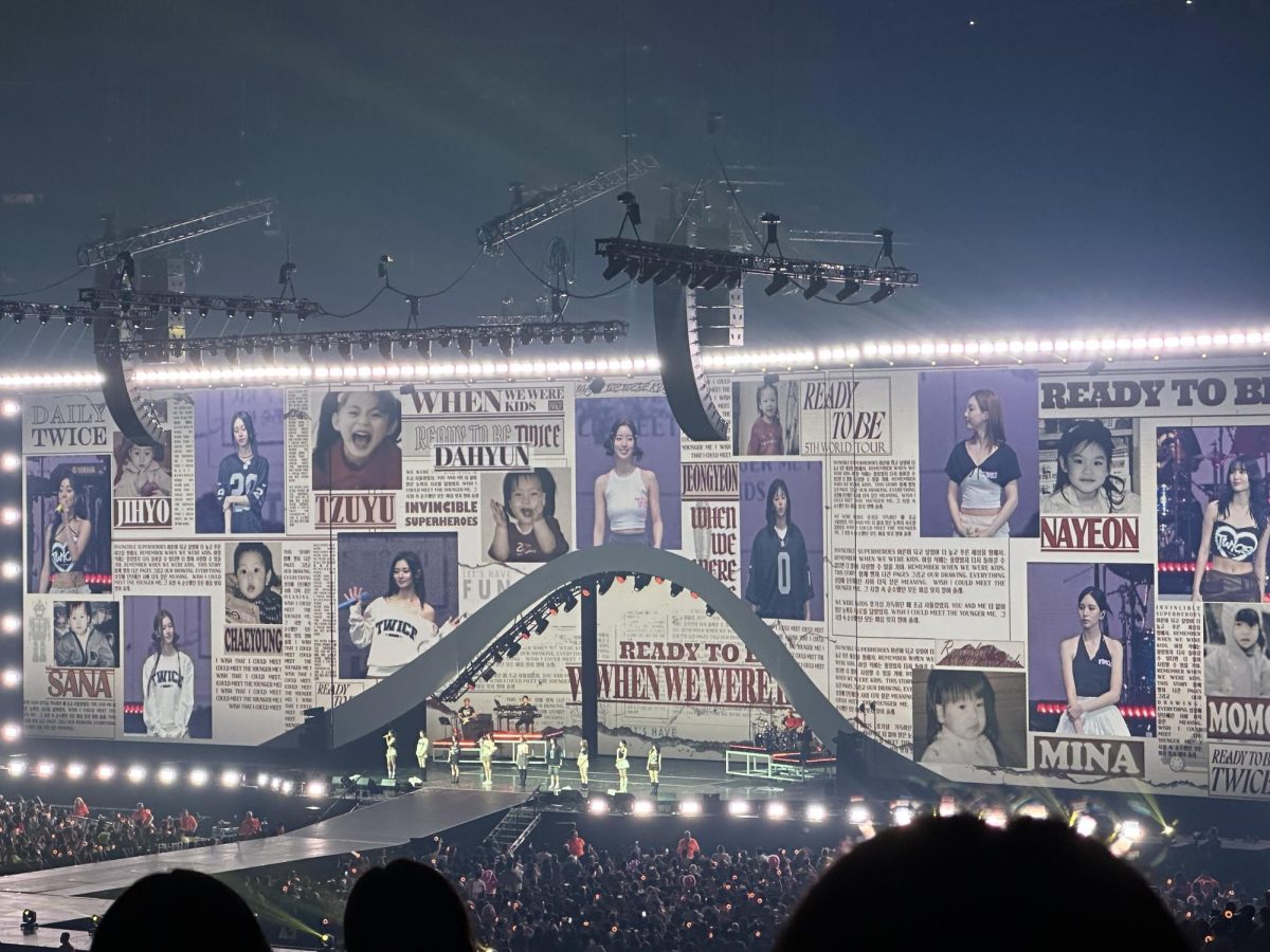 TWICE members on stage with the ground floor audience.